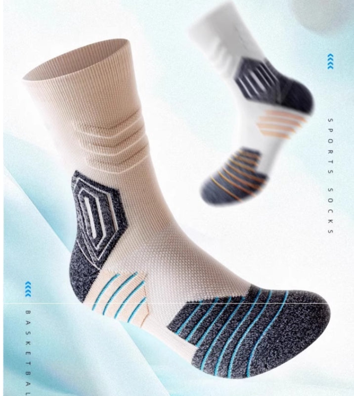 White socks with black and orange patterns worn with black Nike sneakers on a light gray background