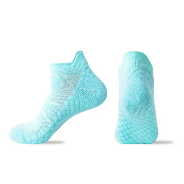 A pair of light blue sports ankle socks designed with a non-slip grip pattern.