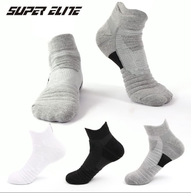 Three pairs of sports socks in white, black, and gray colors, Pedal favs. The socks are designed for comfort and fit, with visible texture indicating elasticity.