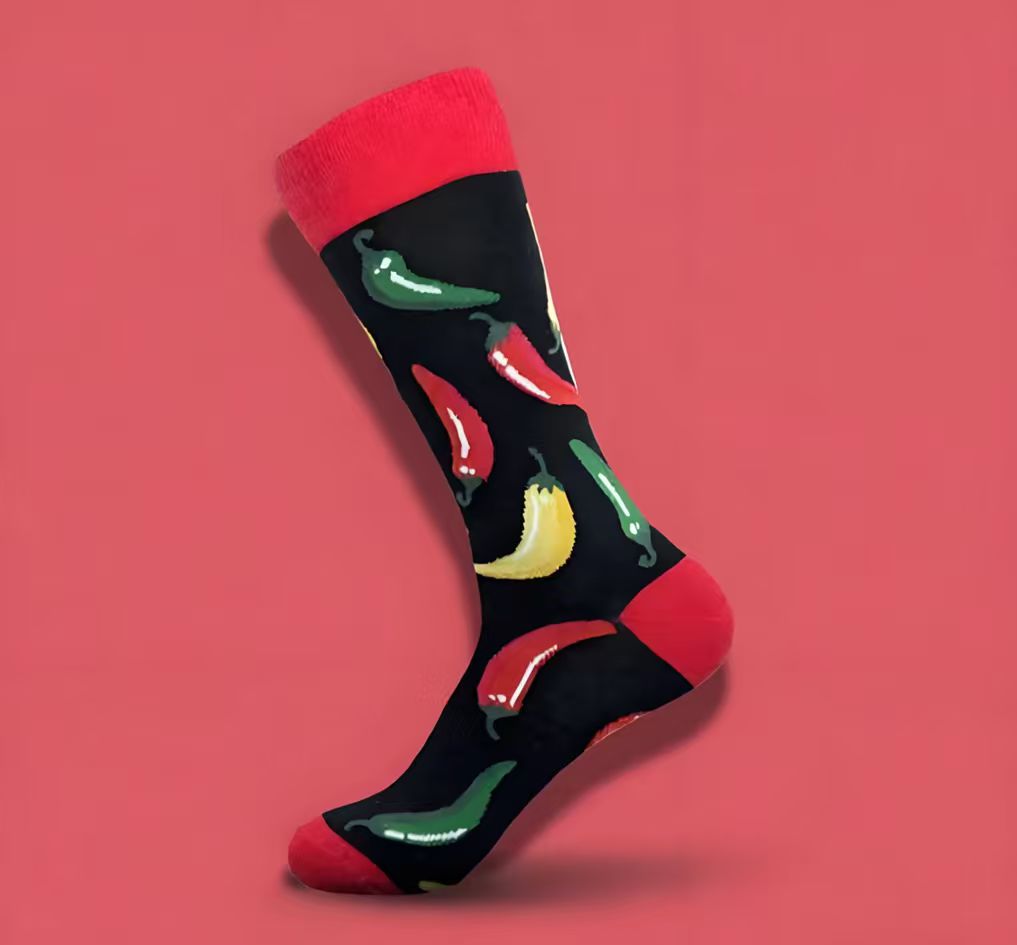 Sock with chili pepper design on a red background